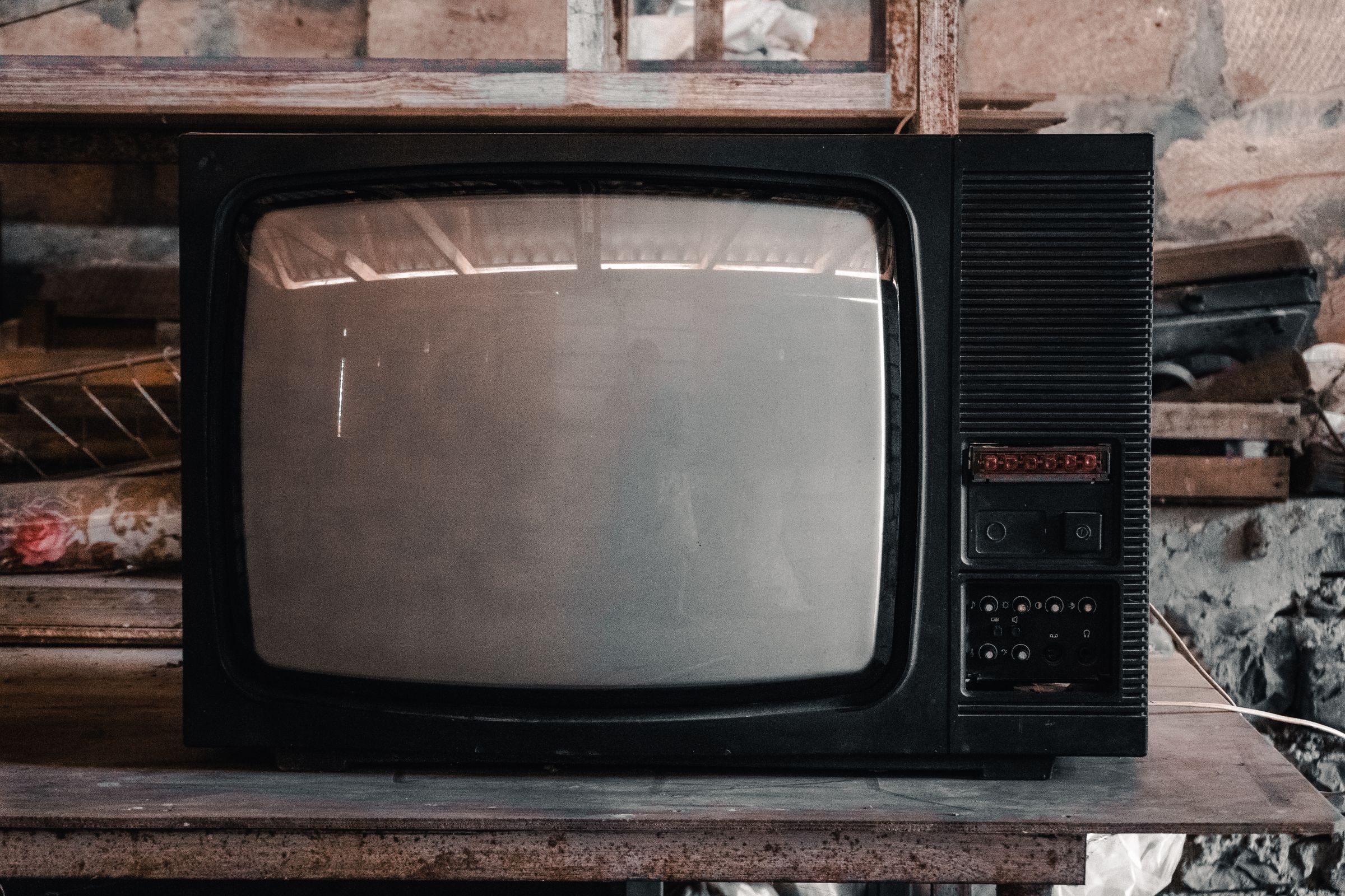 A vintage black television in a workshop